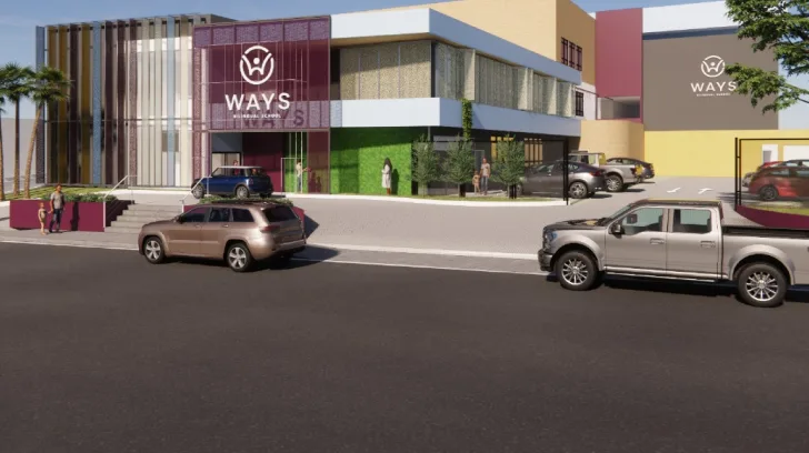 Fachada da Ways São Luís, com o logo da escola e carros no estacionamento